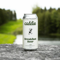 Caddie Breakfast Beer with golf course in background