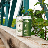 Caddie Foursome non-alcoholic beer variety pack with Breakfast Beer and Early Bird tallboys on a golf course
