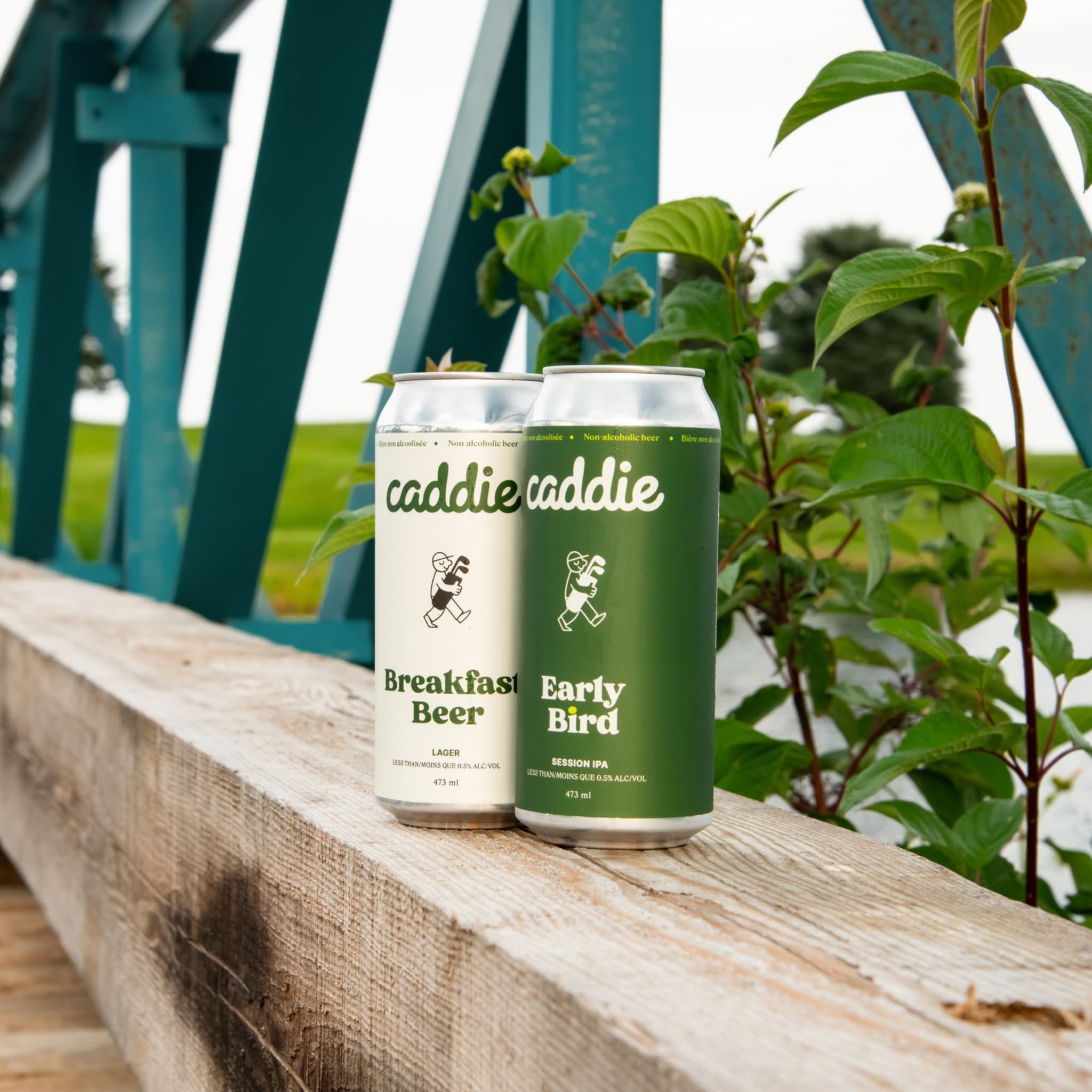 Caddie Foursome non-alcoholic beer variety pack with Breakfast Beer and Early Bird tallboys on a golf course